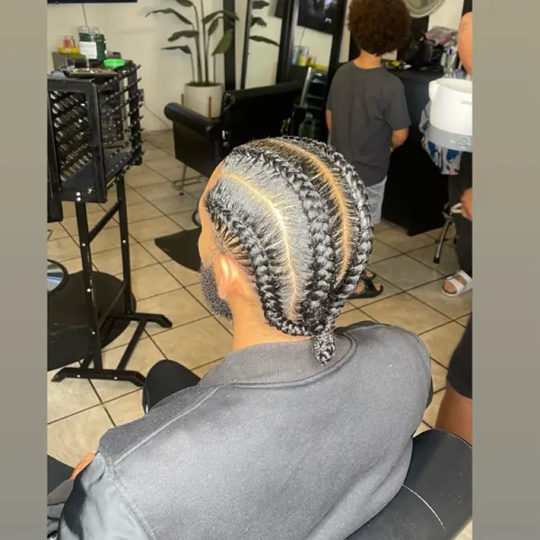 Hair work by Braids By Us