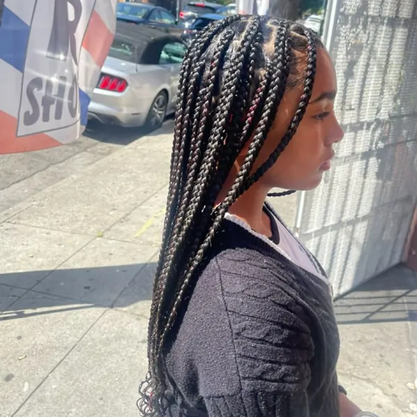 Hair work by Braids By Us