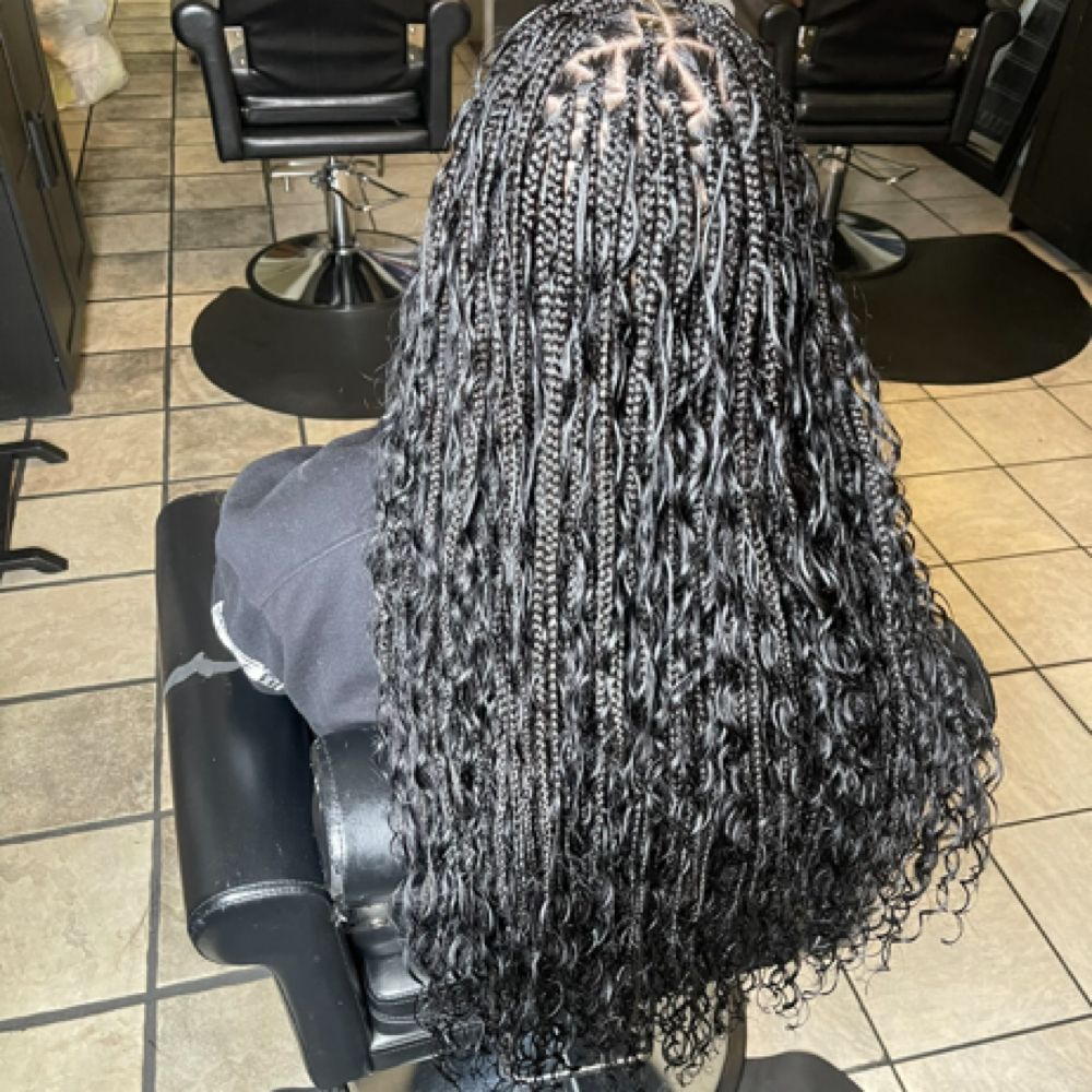 Hair work by Braids By Us