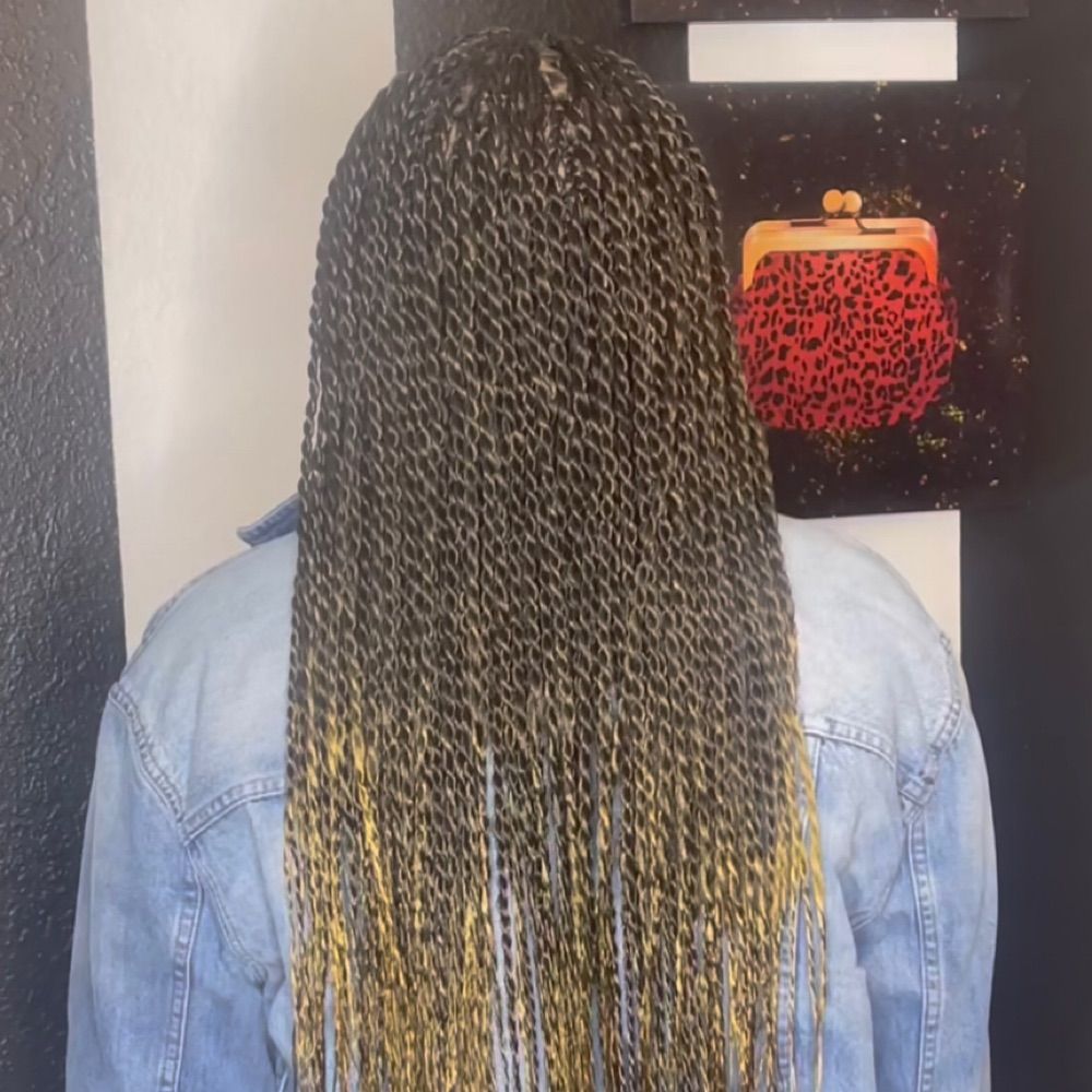 Hair work by Braids By Us