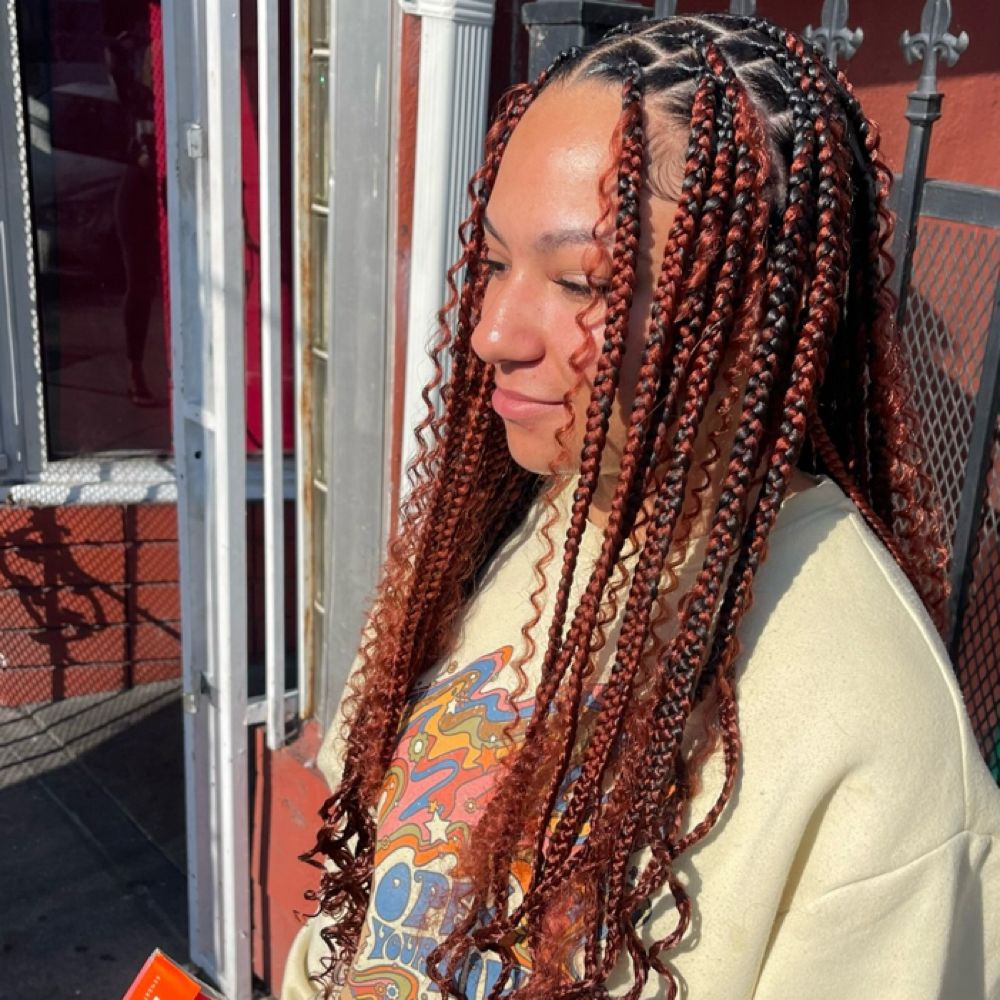 Hair work by Braids By Us