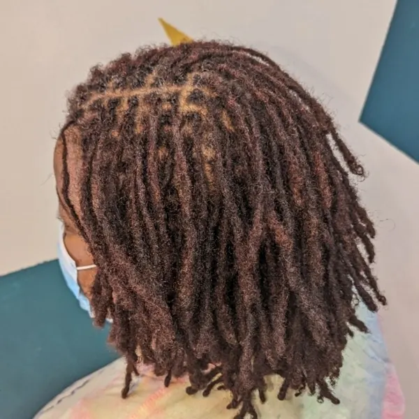 Hair work by Lofty Locs & Tresses