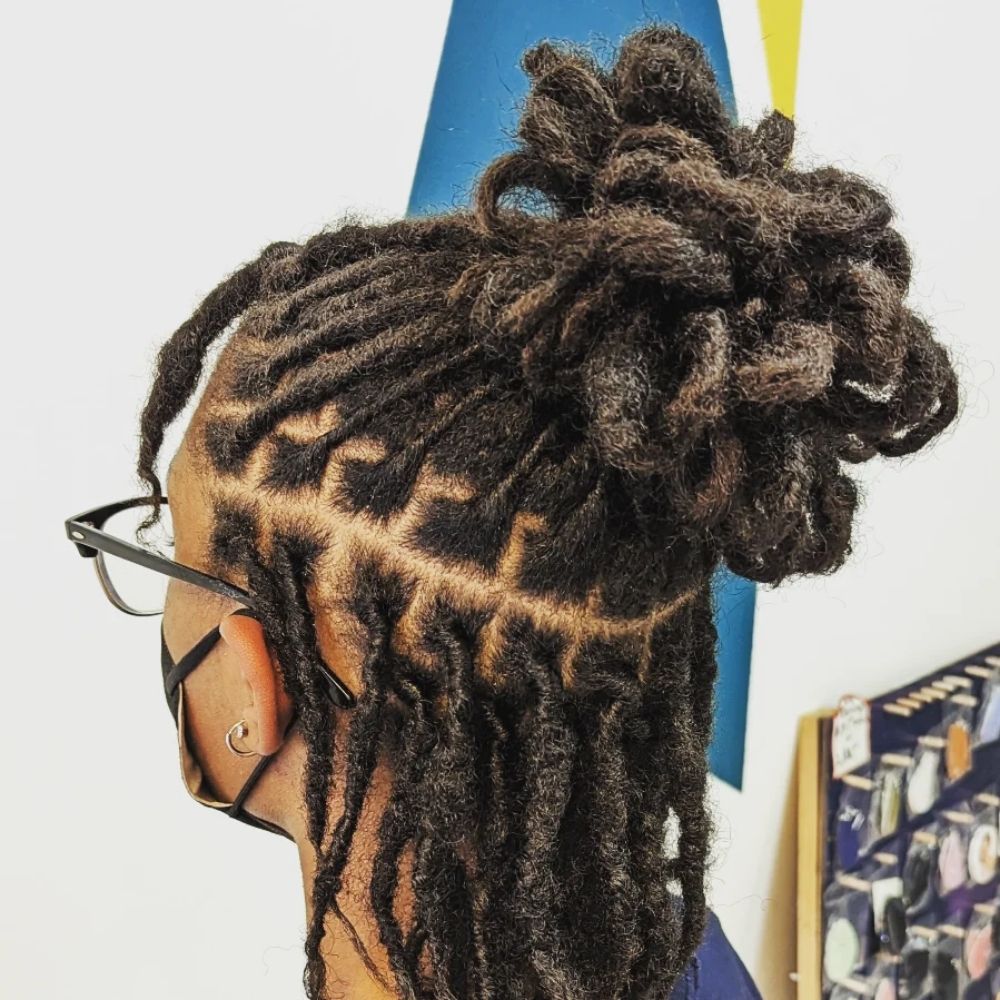 Hair work by Lofty Locs & Tresses
