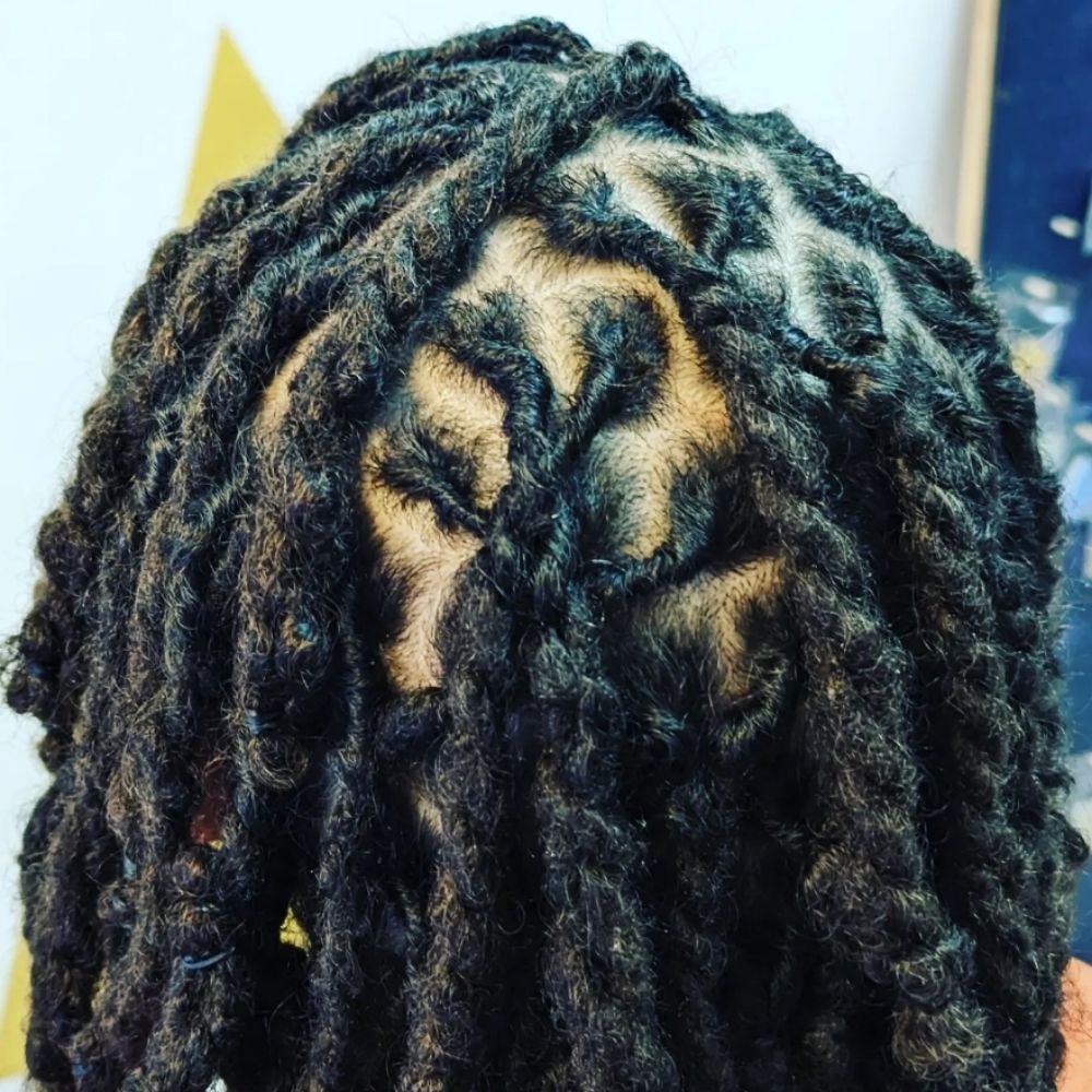 Hair work by Lofty Locs & Tresses